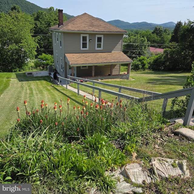 13517 Mcmullen Hwy SW, Cumberland, MD 21502 - rear view of property featuring a chimney, a mountain view, and central AC