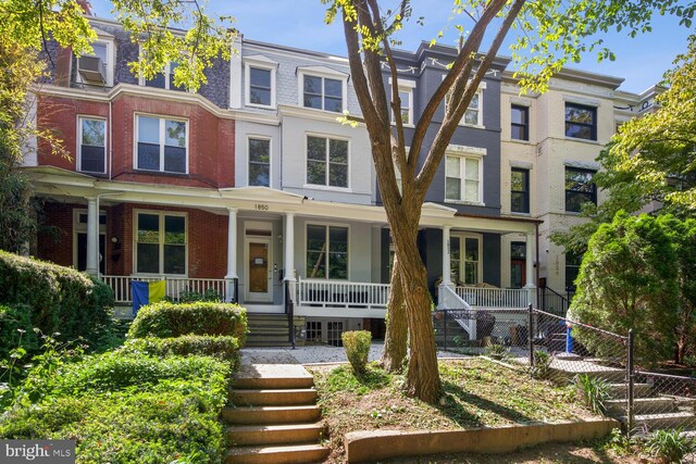 1850 Ingleside Ter NW Unit 2, Washington, DC 20010 - townhome / multi-family property featuring covered porch, brick siding, and stairway