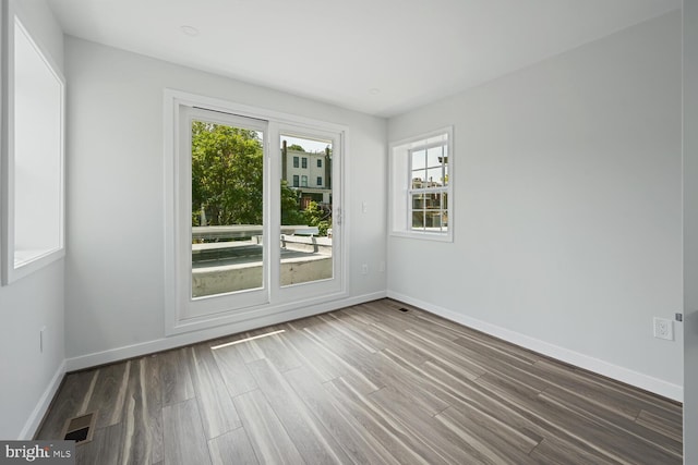 1850 Ingleside Ter NW Unit 2, Washington, DC 20010 - spare room with wood finished floors and baseboards