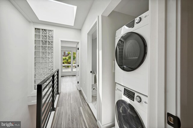 1850 Ingleside Ter NW Unit 2, Washington, DC 20010 - laundry area featuring stacked washer / dryer and baseboards