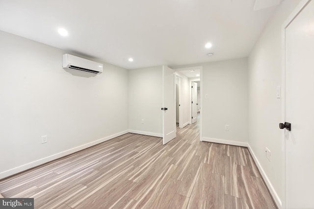 1850 Ingleside Ter NW Unit 2, Washington, DC 20010 - finished basement featuring light wood-style flooring, a wall mounted AC, recessed lighting, and baseboards
