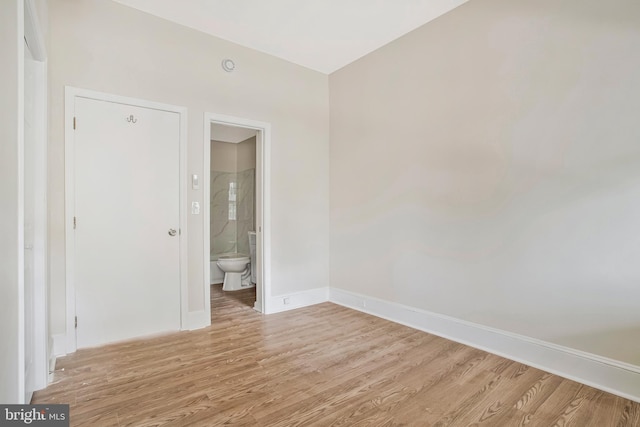 1003 Walnut Ave, Baltimore, MD 21229 - spare room with light wood-style floors and baseboards