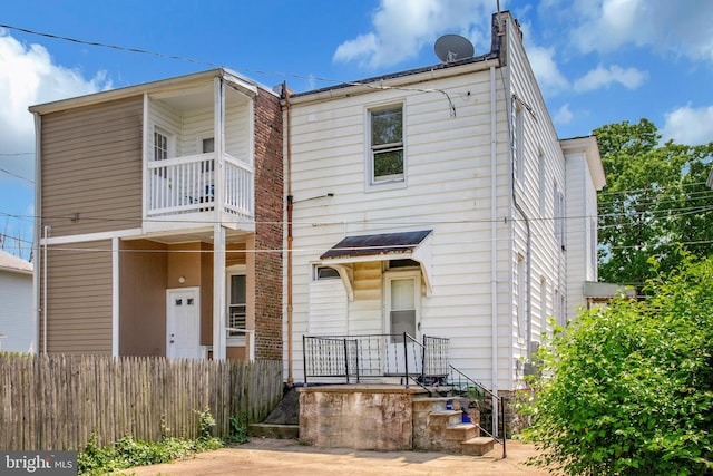 1003 Walnut Ave, Baltimore, MD 21229 - townhome / multi-family property with a balcony