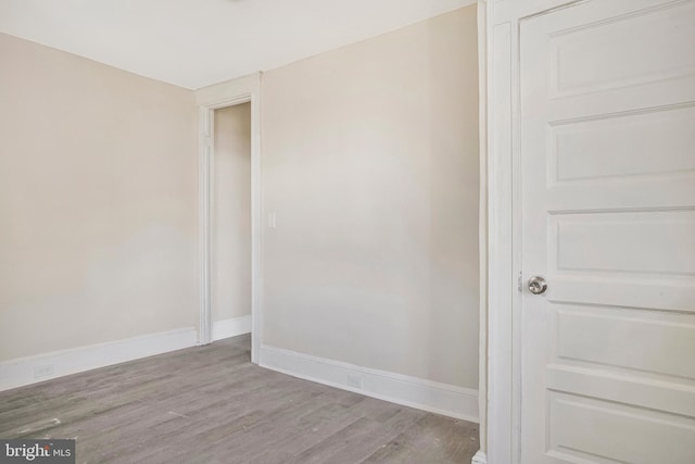 1003 Walnut Ave, Baltimore, MD 21229 - spare room featuring wood finished floors and baseboards