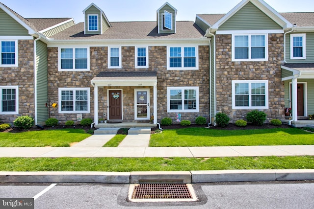 605 Byler Cir, Lebanon, PA 17042 - townhome / multi-family property with stone siding, a front lawn, and a shingled roof
