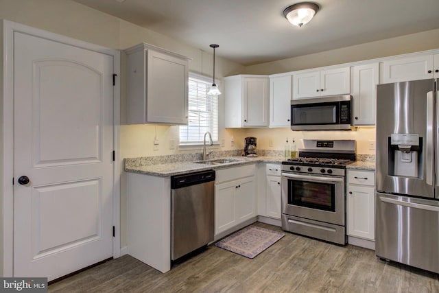605 Byler Cir, Lebanon, PA 17042 - kitchen with appliances with stainless steel finishes, a sink, light wood-style flooring, and white cabinetry