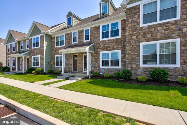 605 Byler Cir, Lebanon, PA 17042 - multi unit property featuring stone siding, a front yard, and roof with shingles