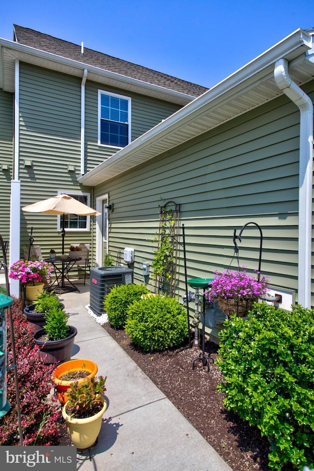 605 Byler Cir, Lebanon, PA 17042 - view of side of home featuring cooling unit, a patio area, and a shingled roof