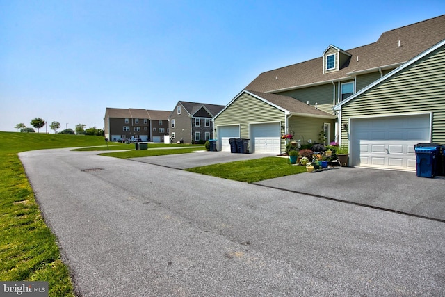 605 Byler Cir, Lebanon, PA 17042 - view of front of property featuring a front yard, driveway, a garage, and a shingled roof