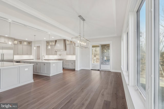 545 Webb Rd # Dd, Chadds Ford, PA 19317 - kitchen featuring stainless steel built in refrigerator, custom range hood, a large island, light countertops, and dark wood-type flooring