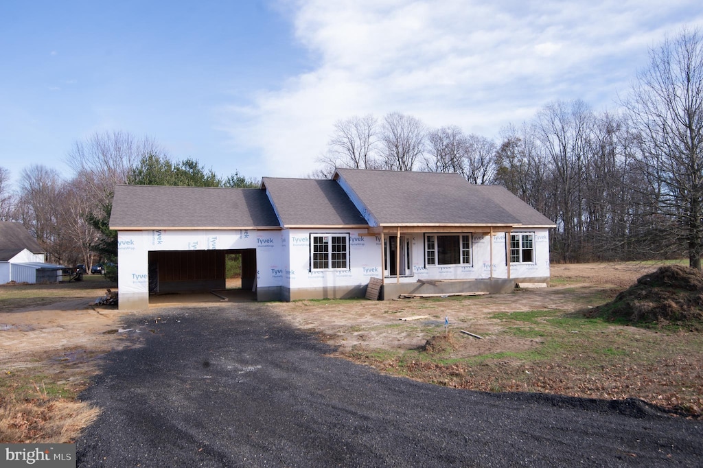 6706 Jayar Way, Hurlock, MD 21643 - property under construction featuring driveway, an attached garage, a shingled roof, and covered porch