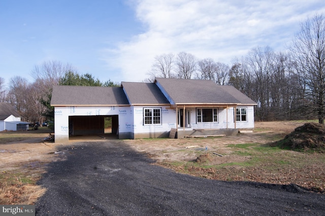 6706 Jayar Way, Hurlock, MD 21643 - property under construction featuring driveway, an attached garage, a shingled roof, and covered porch