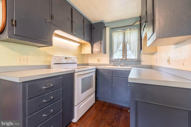404 Clear Ridge Rd, Union Bridge, MD 21791 - kitchen featuring white electric range oven, a sink, dark wood-style floors, and light countertops