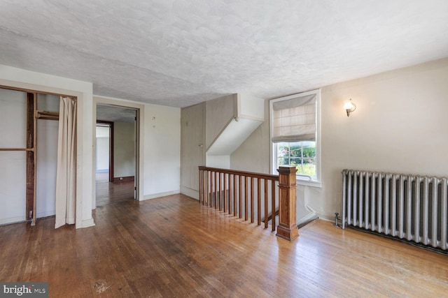 404 Clear Ridge Rd, Union Bridge, MD 21791 - bonus room with radiator, wood finished floors, baseboards, and a textured ceiling