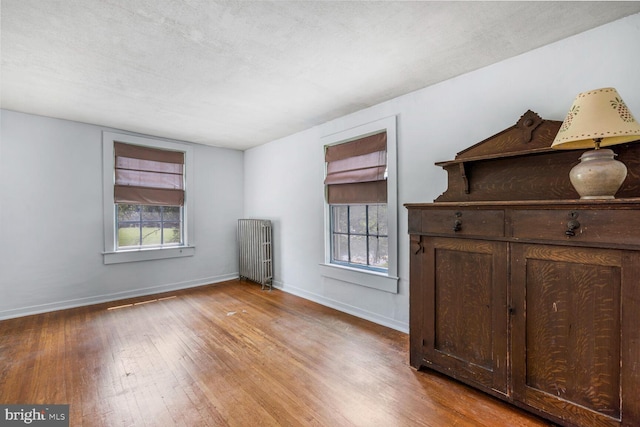 404 Clear Ridge Rd, Union Bridge, MD 21791 - unfurnished bedroom with radiator, hardwood / wood-style floors, and baseboards
