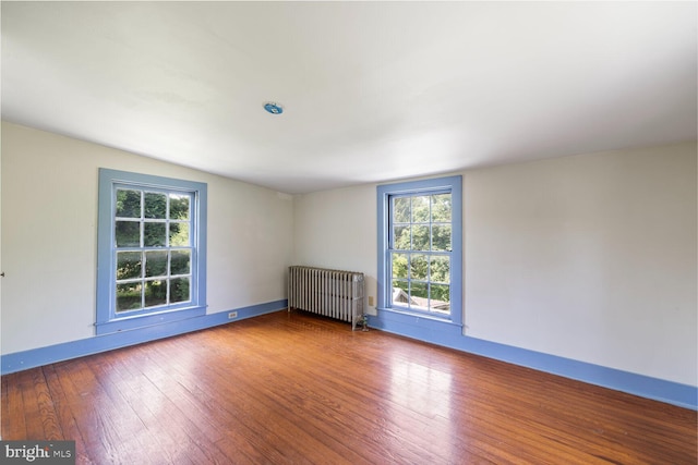 404 Clear Ridge Rd, Union Bridge, MD 21791 - spare room with radiator, hardwood / wood-style floors, plenty of natural light, and baseboards