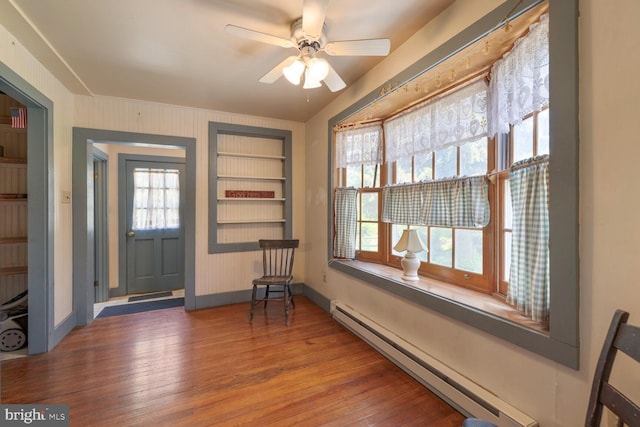 404 Clear Ridge Rd, Union Bridge, MD 21791 - entryway with a baseboard radiator, wood finished floors, ceiling fan, and baseboards
