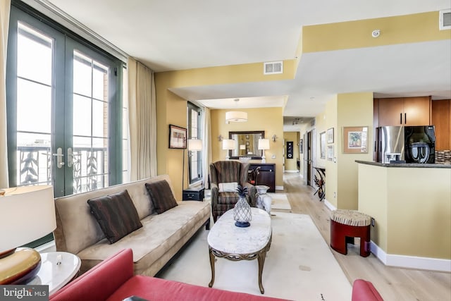 910 M St NW Unit 1022, Washington, DC 20001 - living room with light wood-type flooring and french doors