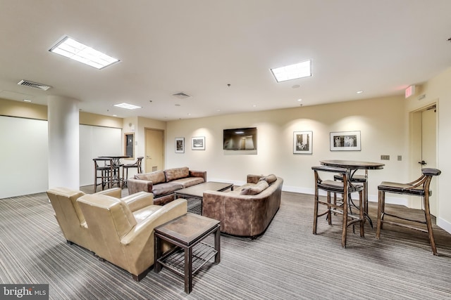910 M St NW Unit 1022, Washington, DC 20001 - carpeted living room featuring baseboards and a skylight