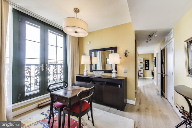 910 M St NW Unit 1022, Washington, DC 20001 - dining room featuring french doors, light wood-style floors, and track lighting