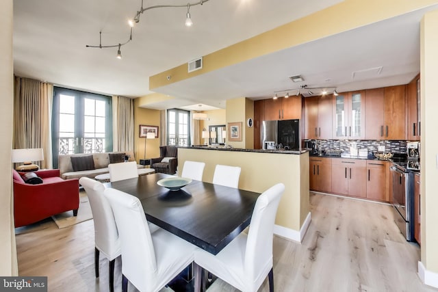910 M St NW Unit 1022, Washington, DC 20001 - dining room featuring rail lighting and light wood finished floors