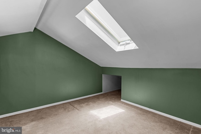 1040 Muscovy Ln, Bensalem, PA 19020 - bonus room featuring a skylight, vaulted ceiling, carpet, and baseboards