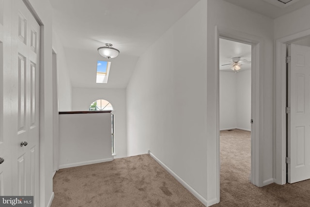 1040 Muscovy Ln, Bensalem, PA 19020 - hall featuring carpet, an upstairs landing, baseboards, a skylight, and vaulted ceiling