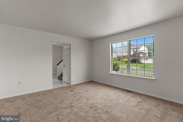1040 Muscovy Ln, Bensalem, PA 19020 - empty room featuring carpet floors, baseboards, and stairway