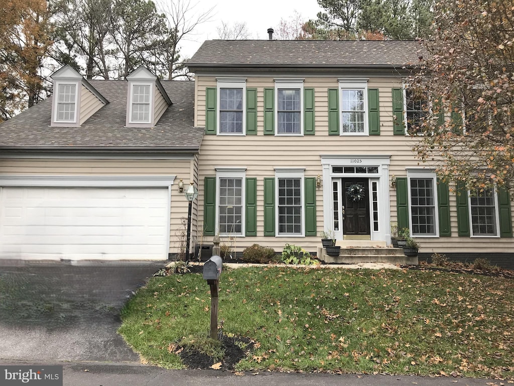 11025 Gaither Hunt Ln, Columbia, MD 21044 - colonial home featuring an attached garage, a shingled roof, and a front lawn