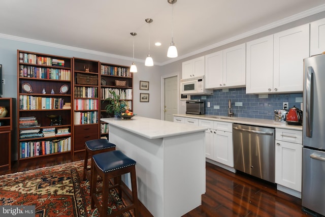 50 Skillman Rd, Skillman, NJ 08558 - kitchen featuring stainless steel appliances, a sink, ornamental molding, dark wood-type flooring, and light countertops