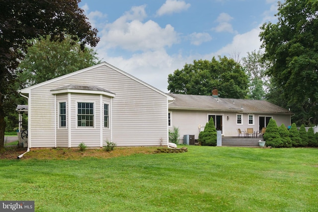 50 Skillman Rd, Skillman, NJ 08558 - rear view of property featuring a lawn, central AC unit, and a deck