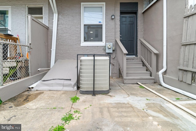 813 N Linwood, Baltimore, MD 21205 - doorway to property with central AC and brick siding
