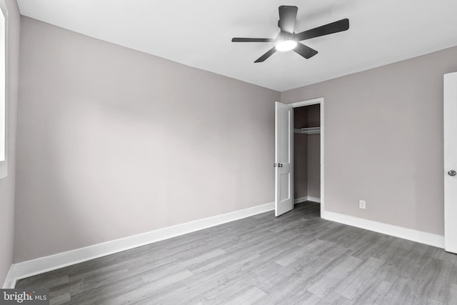 2723 Keating St, Temple Hills, MD 20748 - unfurnished bedroom with wood finished floors, a closet, baseboards, and ceiling fan