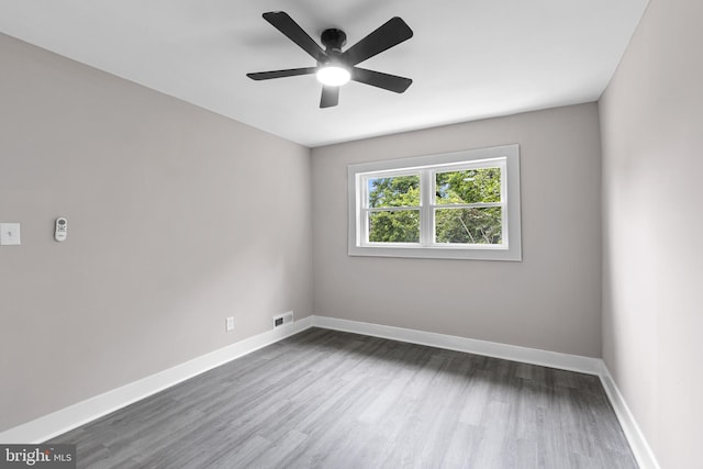 2723 Keating St, Temple Hills, MD 20748 - empty room featuring dark wood-type flooring, baseboards, and a ceiling fan