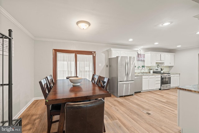34 Swarthmore Ave, Stratford, NJ 08084 - dining space with crown molding, light wood-style floors, and recessed lighting