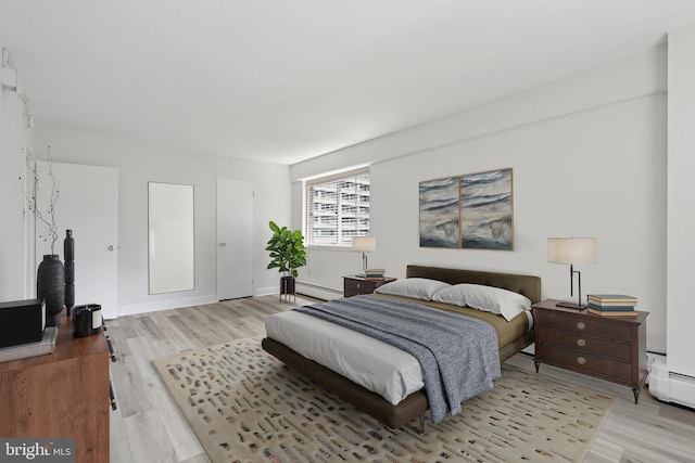1900 John F Kennedy Blvd Unit 924, Philadelphia, PA 19103 - bedroom with light wood-style floors and a baseboard heating unit