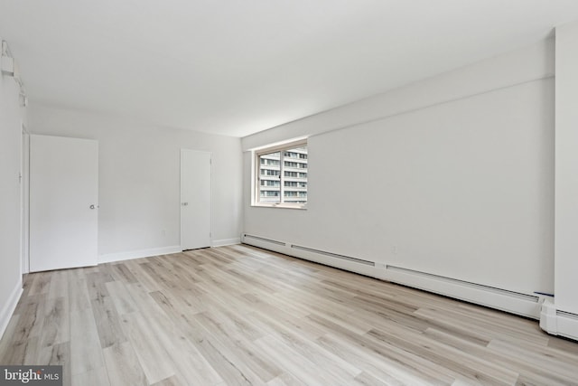 1900 John F Kennedy Blvd Unit 924, Philadelphia, PA 19103 - spare room with a baseboard radiator and light wood finished floors