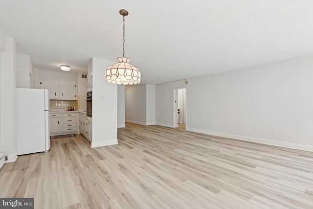 1900 John F Kennedy Blvd Unit 924, Philadelphia, PA 19103 - unfurnished living room featuring light wood finished floors and baseboards