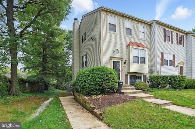 7100 Cipriano Springs Dr, Lanham, MD 20706 - multi unit property featuring a front lawn, cooling unit, and a chimney