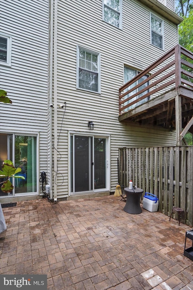 7100 Cipriano Springs Dr, Lanham, MD 20706 - rear view of property with a patio and a balcony