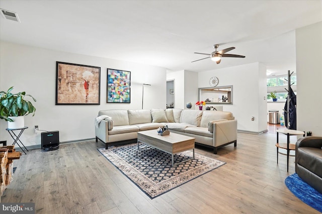 7100 Cipriano Springs Dr, Lanham, MD 20706 - living area with ceiling fan, light wood-style flooring, and baseboards