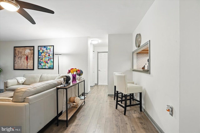 7100 Cipriano Springs Dr, Lanham, MD 20706 - living room featuring ceiling fan, wood finished floors, and baseboards