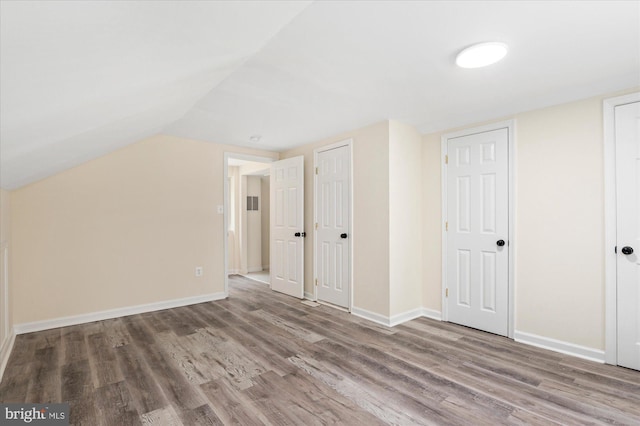 12820 Maple St, Silver Spring, MD 20904 - additional living space featuring wood finished floors, baseboards, and vaulted ceiling