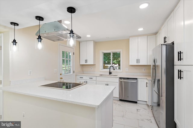 12820 Maple St, Silver Spring, MD 20904 - kitchen featuring appliances with stainless steel finishes, a sink, light marble finish floors, a peninsula, and recessed lighting