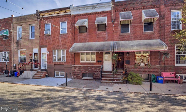 2637 S Bouvier St, Philadelphia, PA 19145 - view of property featuring brick siding, entry steps, and cooling unit