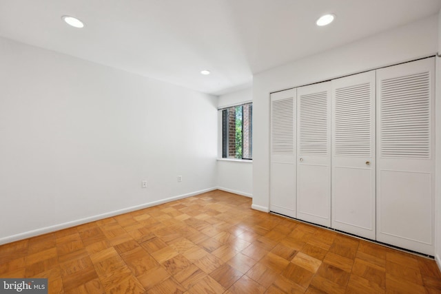 2114 Bonnywood Ln Unit 201, Silver Spring, MD 20902 - unfurnished bedroom featuring baseboards, recessed lighting, and a closet