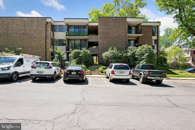 2114 Bonnywood Ln Unit 201, Silver Spring, MD 20902 - view of building exterior with uncovered parking