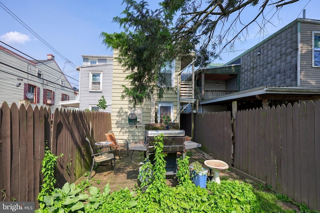 125 S 3rd St, Lebanon, PA 17042 - rear view of house featuring a patio and a shingled roof