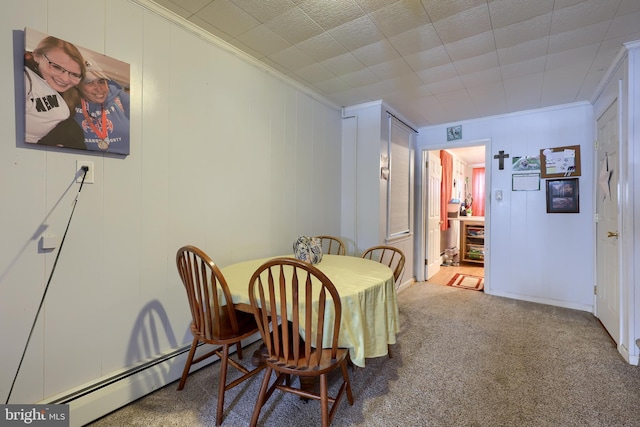 125 S 3rd St, Lebanon, PA 17042 - carpeted dining area with ornamental molding, baseboard heating, and a decorative wall