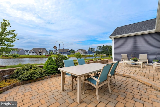 30957 Fowlers Path, Millsboro, DE 19966 - view of patio featuring a water view, outdoor dining space, and a residential view